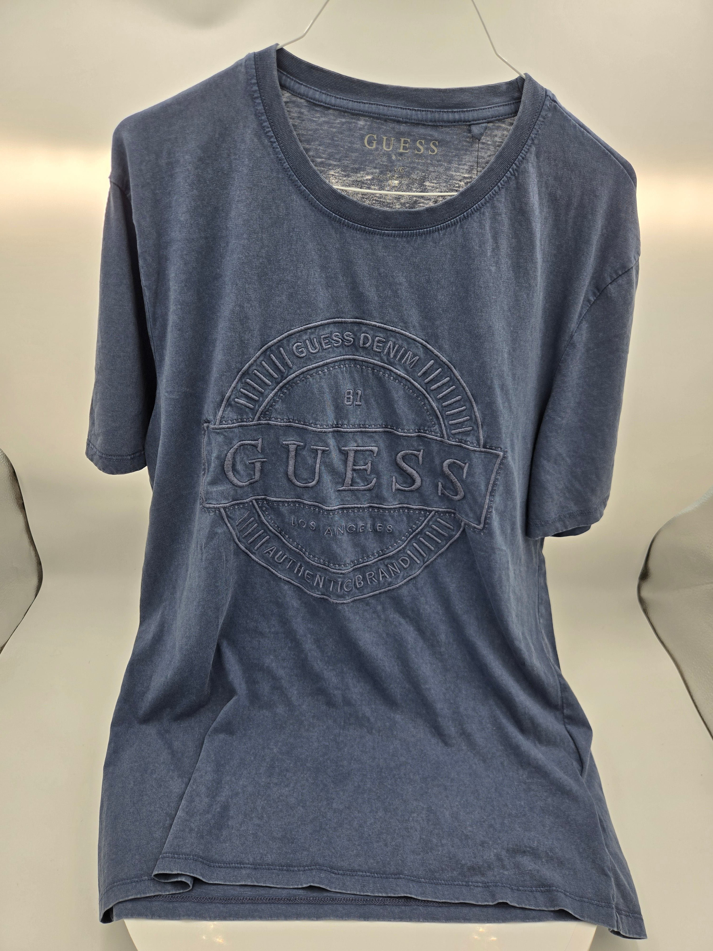 Guess Denim Embroidered Logo T-Shirt – (Length: 28 in (71.1 cm) : Chest Width (Pit to Pit): 20 in (50.8 cm) : Weight: 0.164 kg) ✔ New with original GUESS tags attached.Vintage Blue | Large | Made in Bangladesh | Curator's Choice