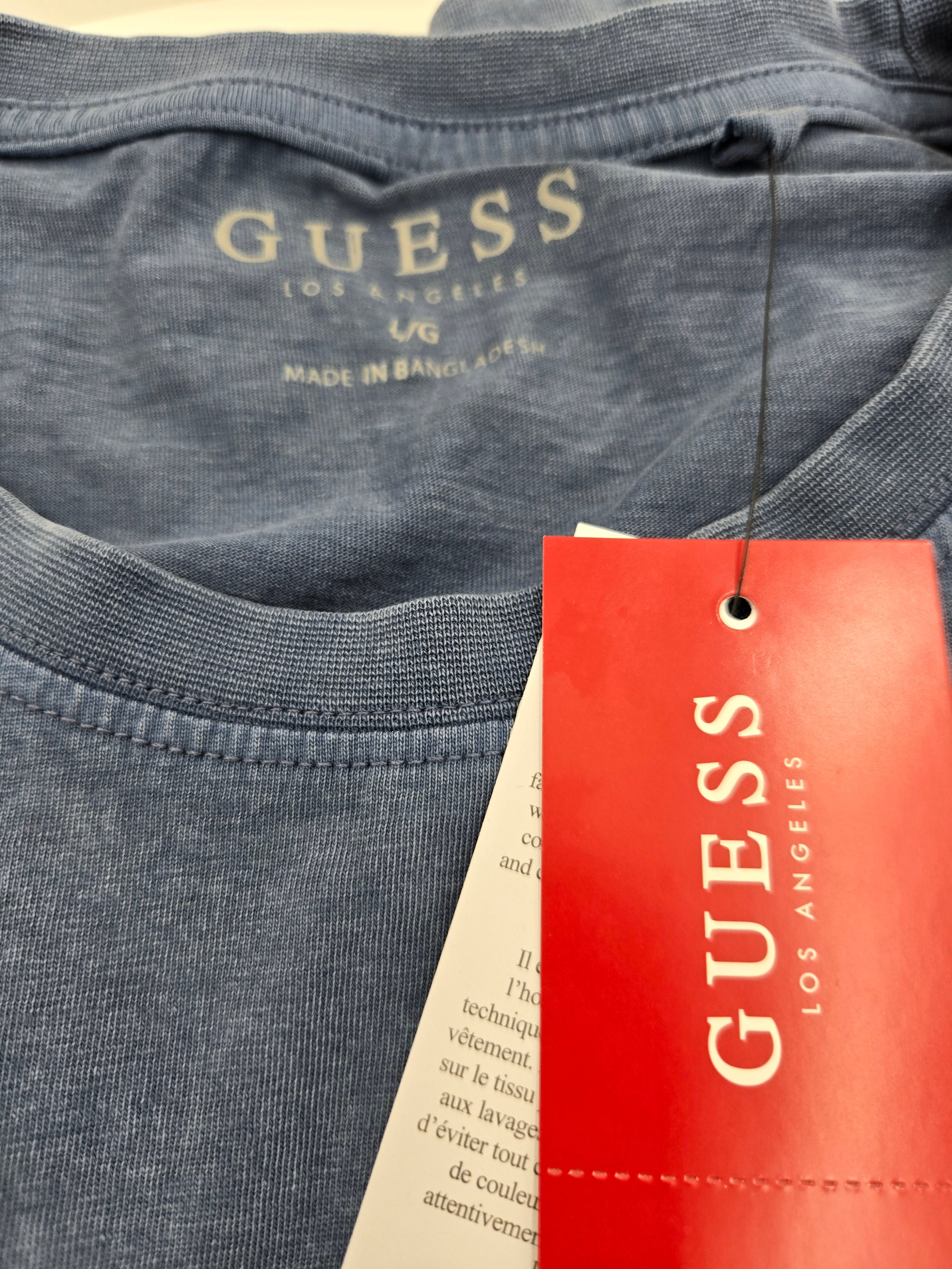 Guess Denim Embroidered Logo T-Shirt – (Length: 28 in (71.1 cm) : Chest Width (Pit to Pit): 20 in (50.8 cm) : Weight: 0.164 kg) ✔ New with original GUESS tags attached.Vintage Blue | Large | Made in Bangladesh | Curator's Choice